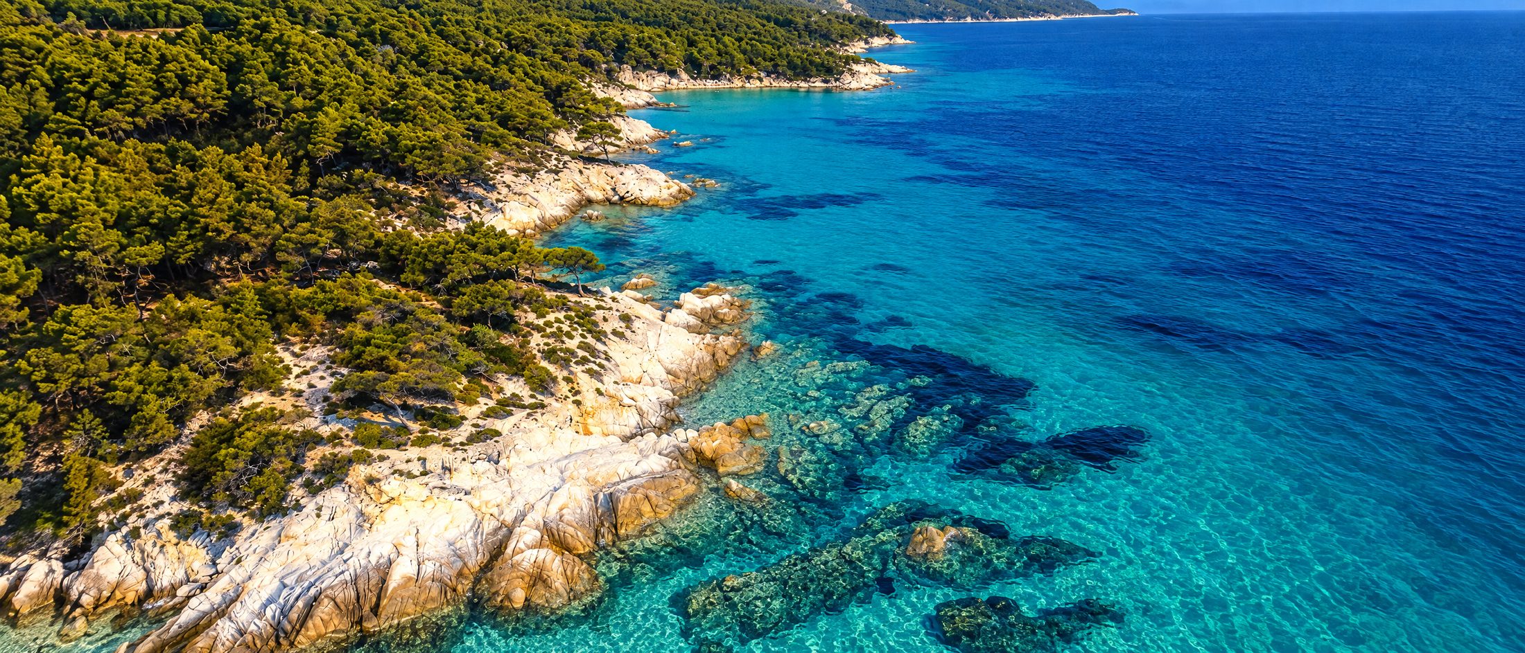 White marble rocks and clear turquoise water on the Sithonia coast, Halkidiki